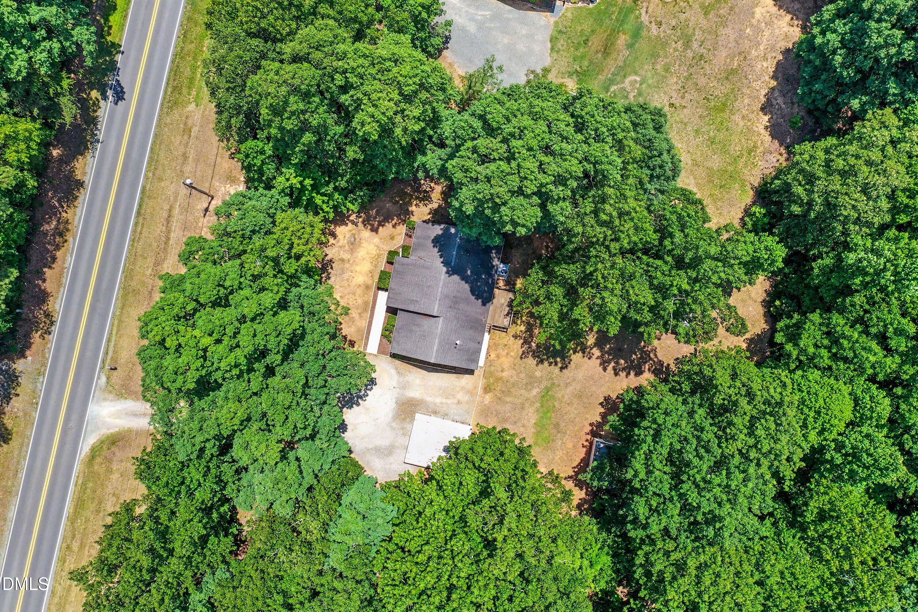 5359 Bass Mountain Road Snow Camp, NC 27349 - Photo 22 of 25 an aerial view of a house with a yard