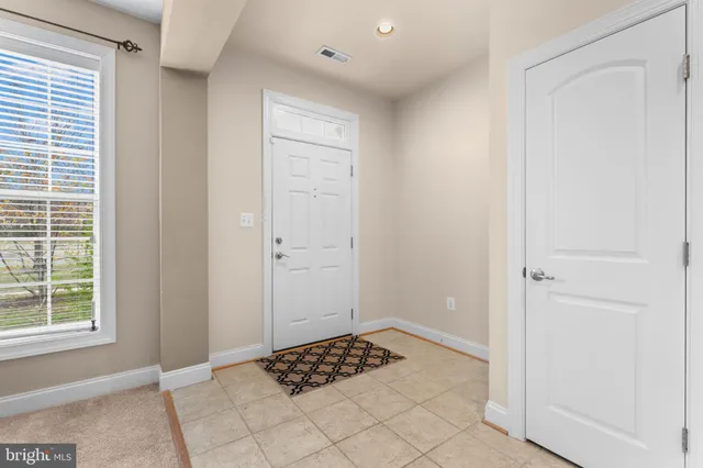 a living room with furniture and windows