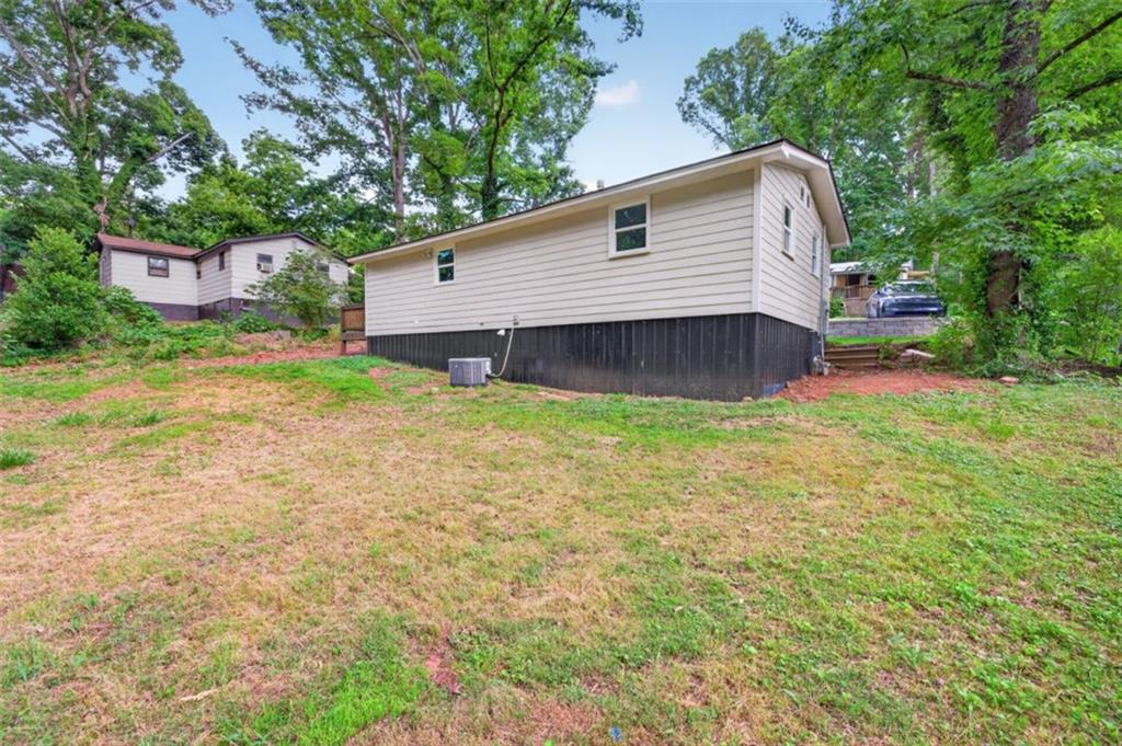136 Nowell Street Monroe, GA 30655 - Photo 7 of 25 a view of a house with a yard