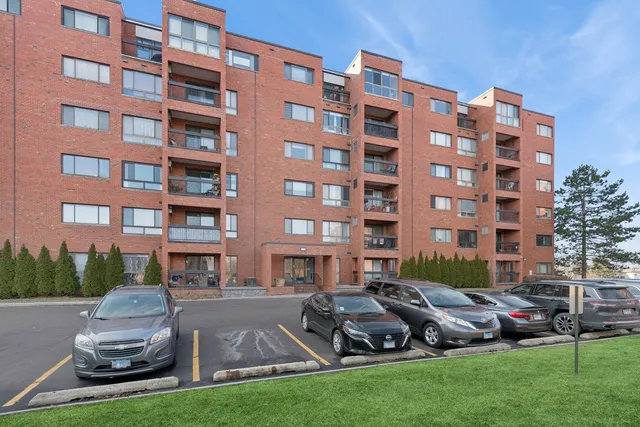 a front view of a building with outdoor seating