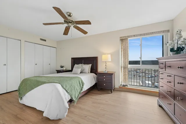 a bedroom with a bed and cabinet