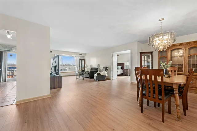a view of a dining room with furniture and wooden floor