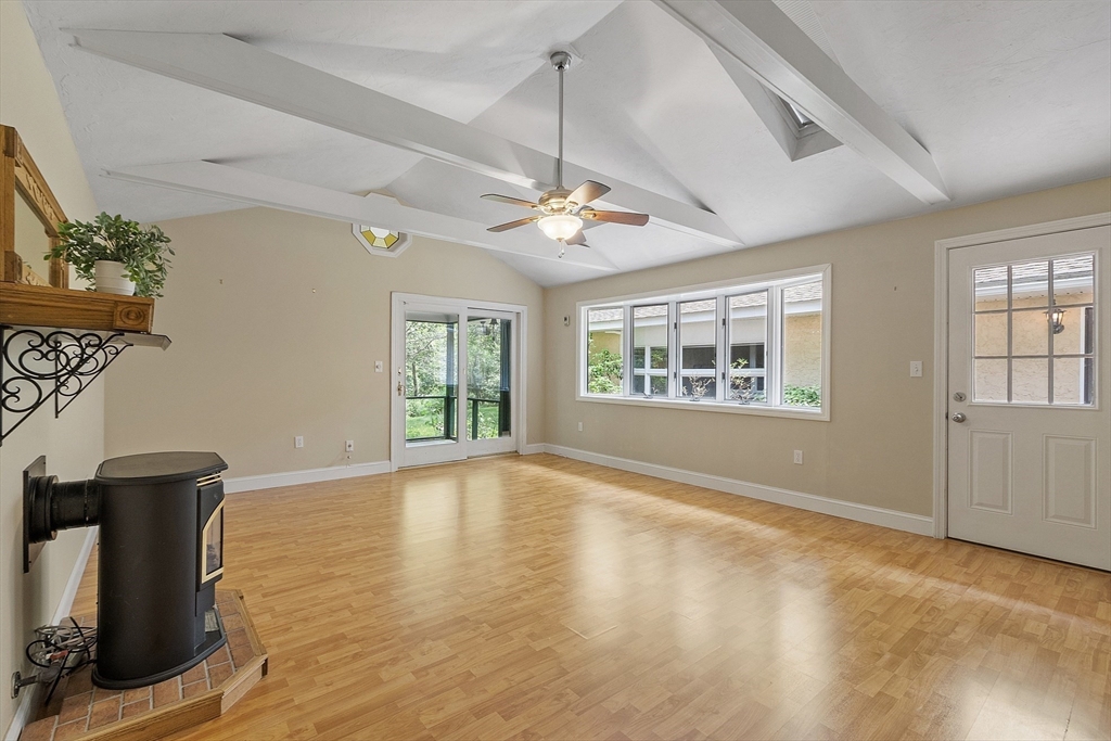 73 Forest Road Millis, MA 02054 - Photo 14 of 34 a view of an empty room with a window and wooden floor