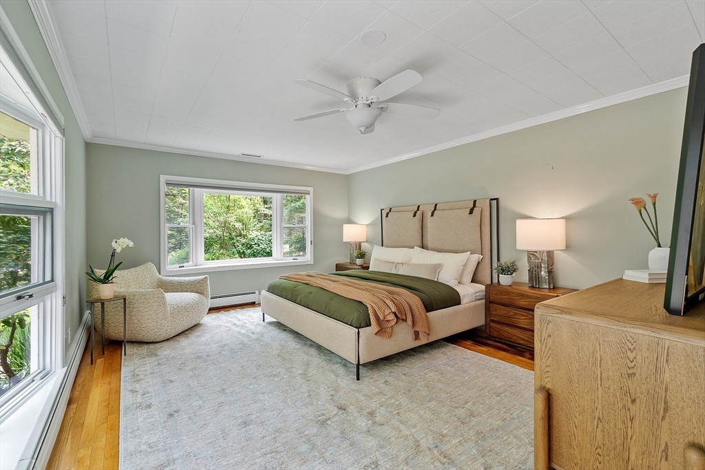 73 Forest Road Millis, MA 02054 - Photo 15 of 34 a spacious bedroom with a bed and a couch