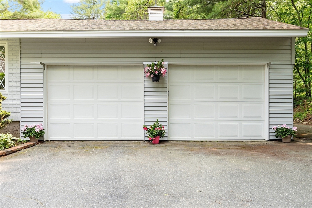 73 Forest Road Millis, MA 02054 - Photo 2 of 34 a view of the house with a garage