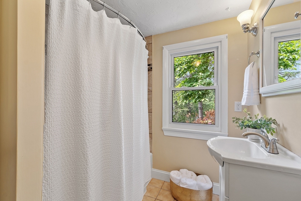 73 Forest Road Millis, MA 02054 - Photo 22 of 34 a bathroom with a sink toilet and a mirror