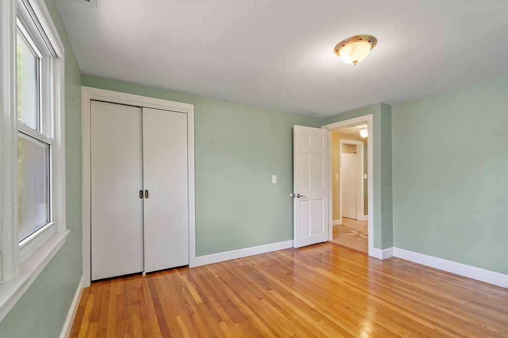 73 Forest Road Millis, MA 02054 - Photo 25 of 34 a view of empty room with wooden floor and fan