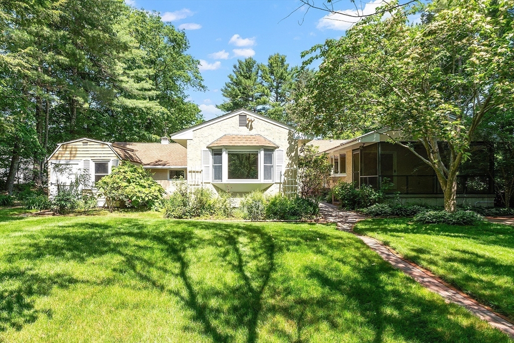 73 Forest Road Millis, MA 02054 - Photo 27 of 34 a front view of a house with a yard and trees
