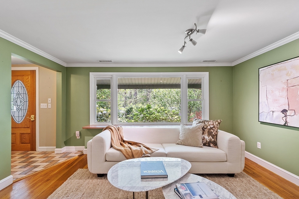 73 Forest Road Millis, MA 02054 - Photo 6 of 34 a living room with furniture and a large window