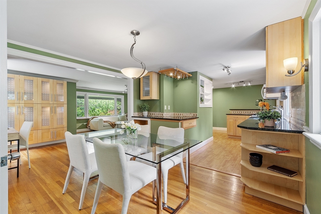73 Forest Road Millis, MA 02054 - Photo 10 of 34 a view of a dining room with furniture and a chandelier