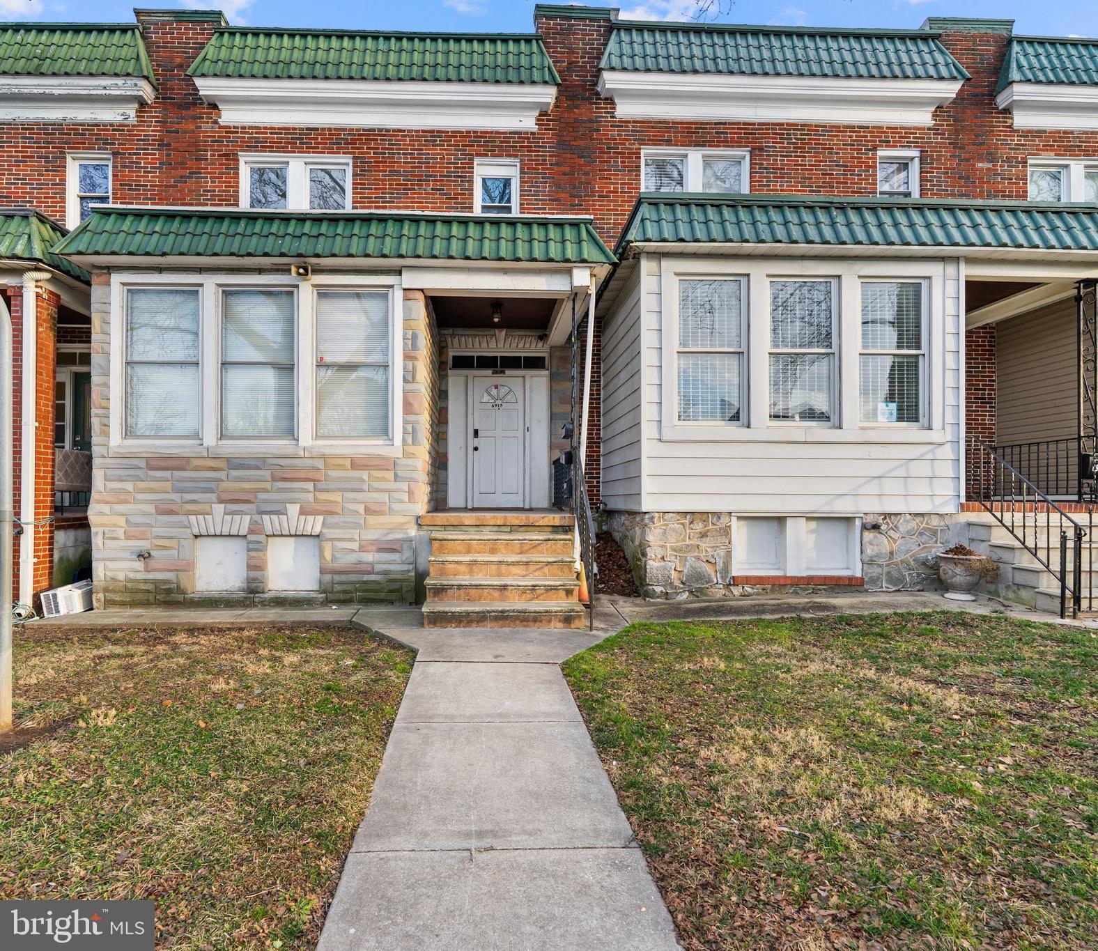 6915 Harford Road, Unit 3 Baltimore, MD 21234 - Photo 15 of 16 a front view of a house with a garden
