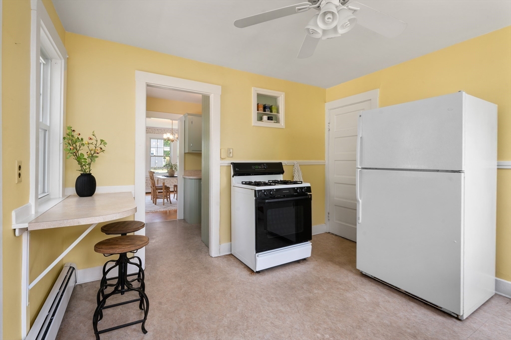 8 Overlook Road Wakefield, MA 01880 - Photo 21 of 41 a kitchen with a refrigerator and a stove top oven