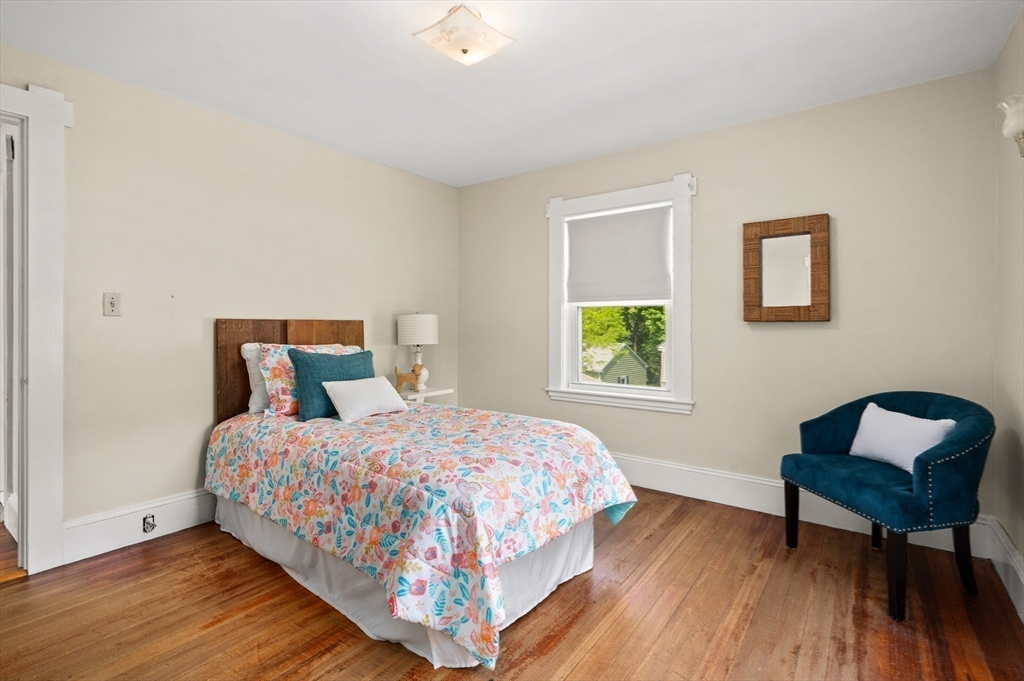 8 Overlook Road Wakefield, MA 01880 - Photo 29 of 41 a bedroom with a bed a table and chair