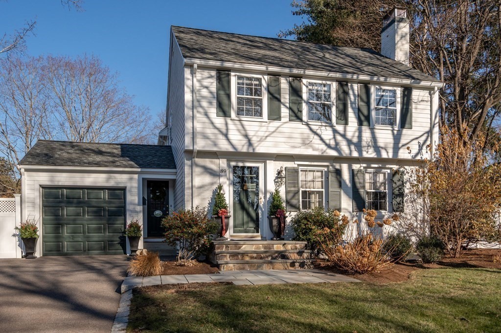 89 Beechwood Road Wellesley, MA 02482 - Photo 2 of 32 a front view of a house with yard outdoor seating and covered with trees