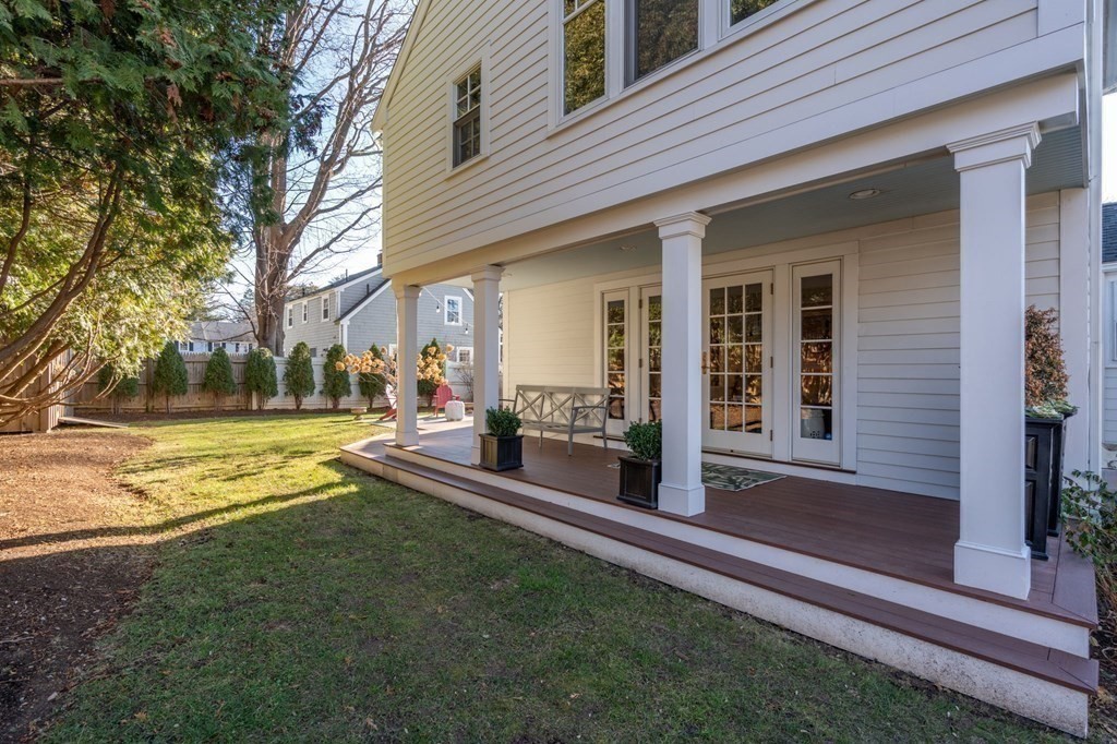 89 Beechwood Road Wellesley, MA 02482 - Photo 23 of 32 a view of a house with a swimming pool and porch with furniture