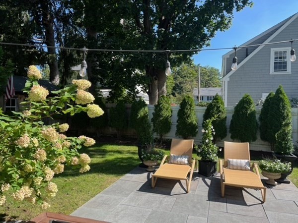 89 Beechwood Road Wellesley, MA 02482 - Photo 32 of 32 a view of yard with outdoor seating and flowers in the background