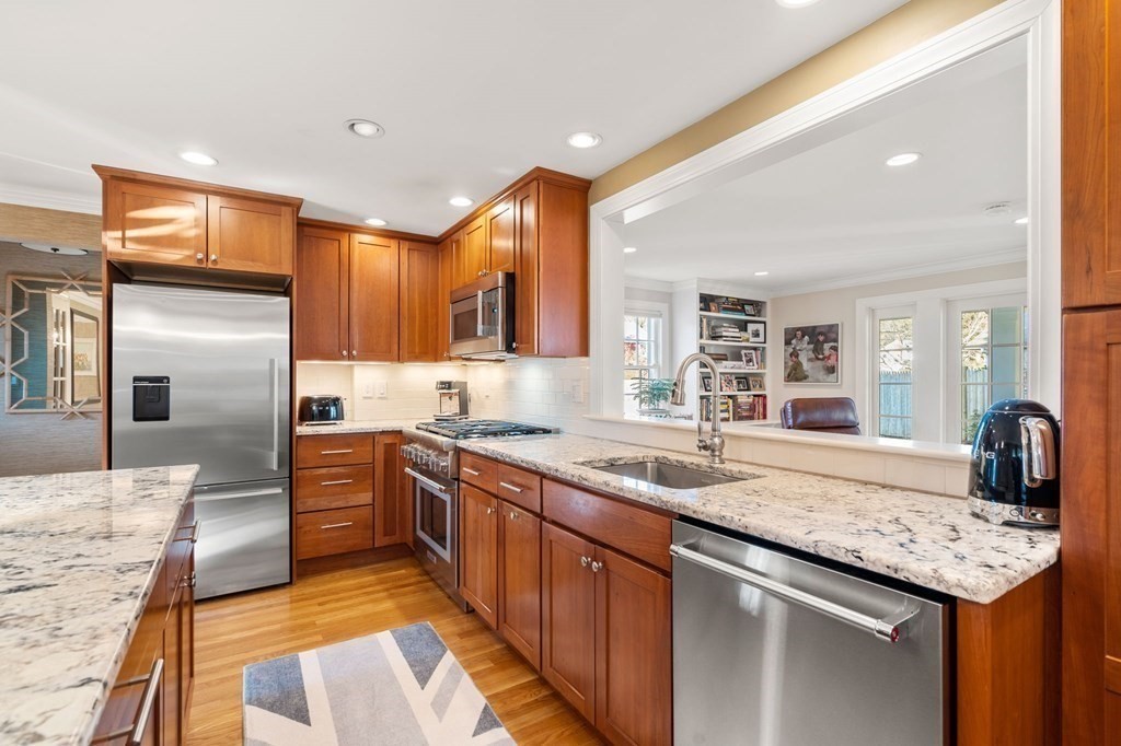 89 Beechwood Road Wellesley, MA 02482 - Photo 4 of 32 a kitchen with granite countertop a sink and stainless steel appliances