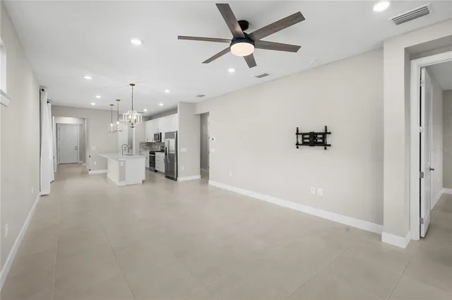 a view of an empty room with windows