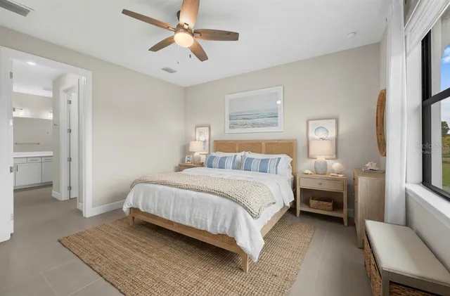 a kitchen with stainless steel appliances granite countertop a refrigerator a sink a stove and a refrigerator