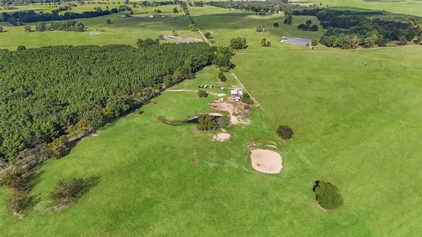 a view of a lake with a yard
