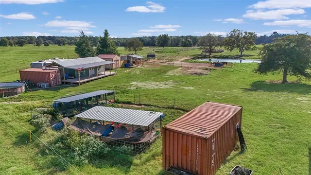 an aerial view of a house with garden space and street view