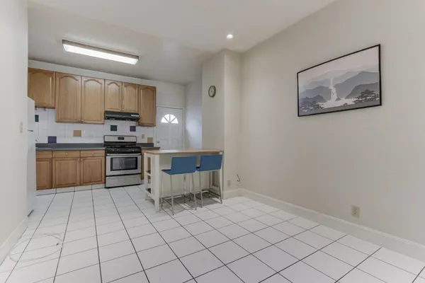 a kitchen with a cabinets and chairs