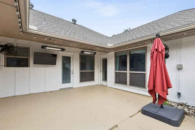 a view of a house with a flat screen tv