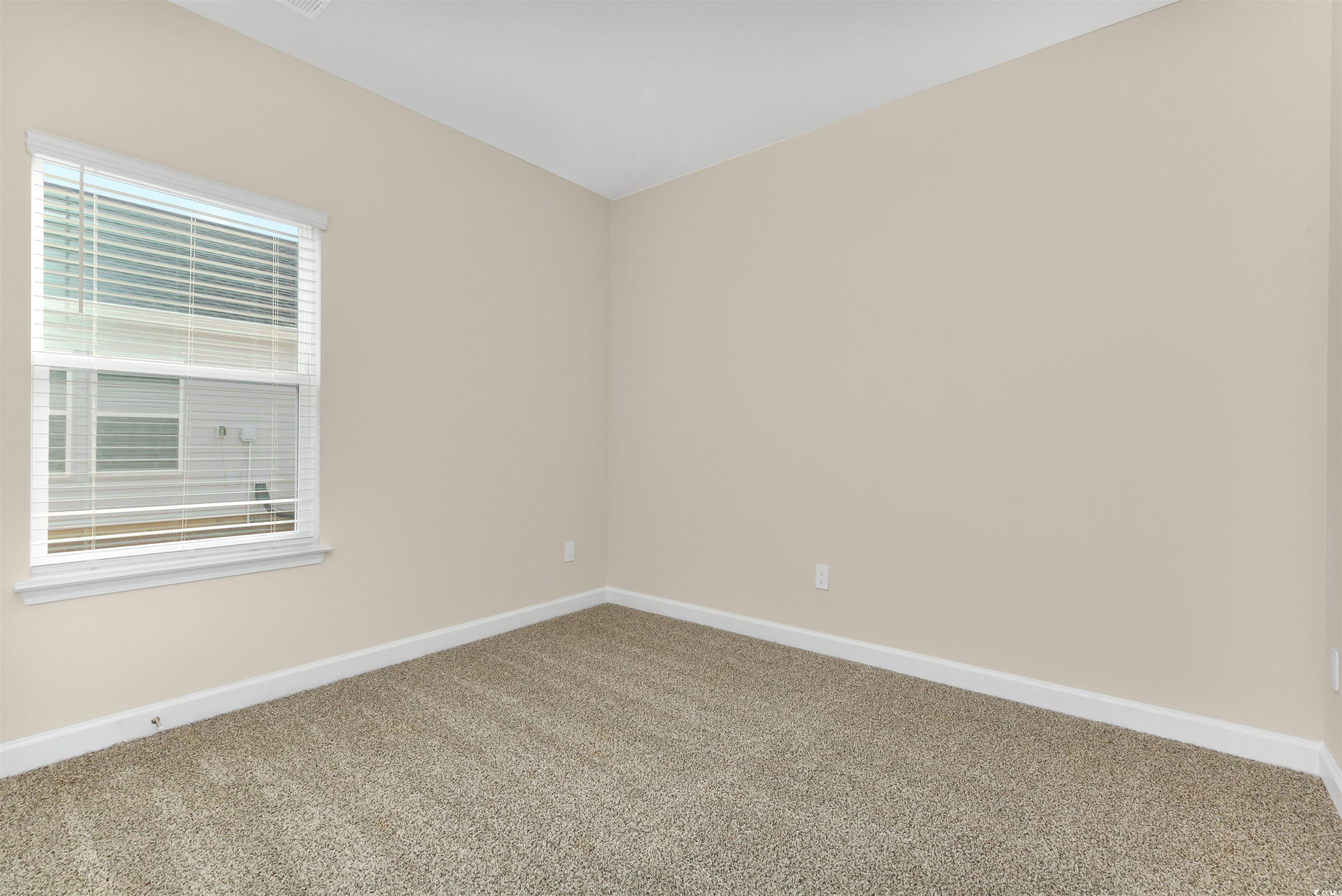 826 Cypress Preserve Circle Longs, SC 29568 - Photo 21 of 27 Carpeted empty room with baseboards