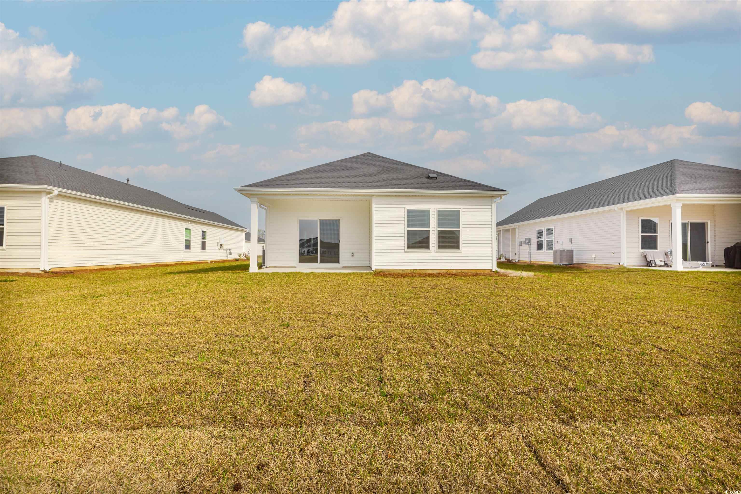 826 Cypress Preserve Circle Longs, SC 29568 - Photo 27 of 27 Rear view of property featuring cooling unit and a yard