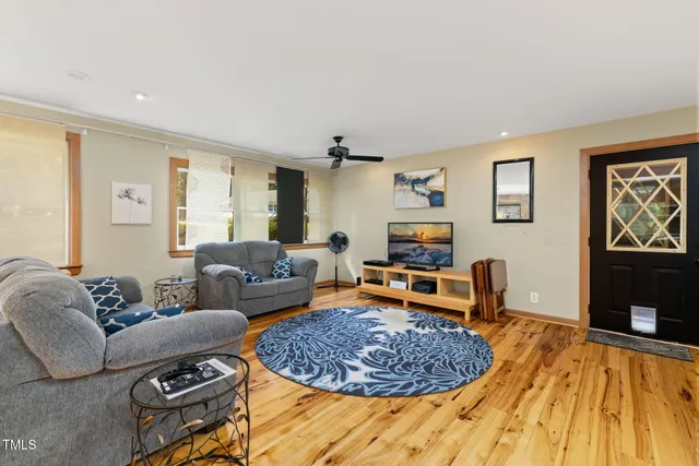 a view of a wooden deck with a yard