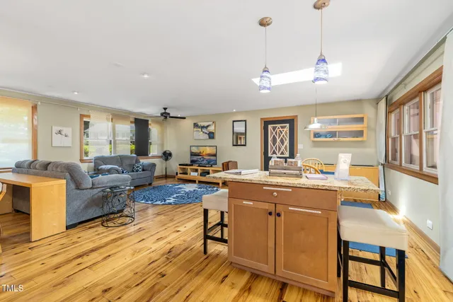a kitchen with a stove a sink and a refrigerator