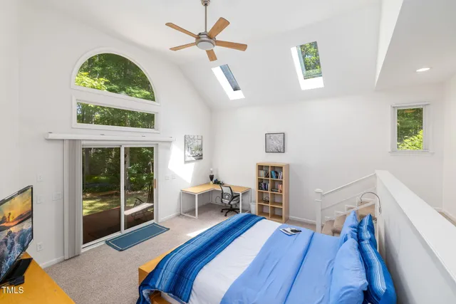 a bedroom with a bed and a fireplace