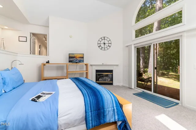 a bed room with a bed and a window