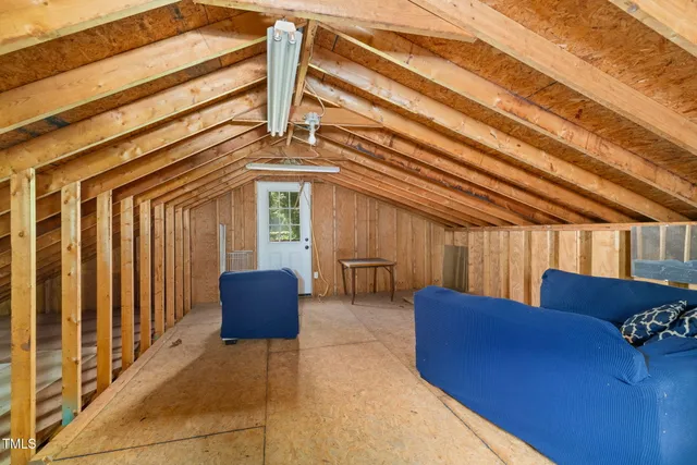 a view of a wooden deck with a yard