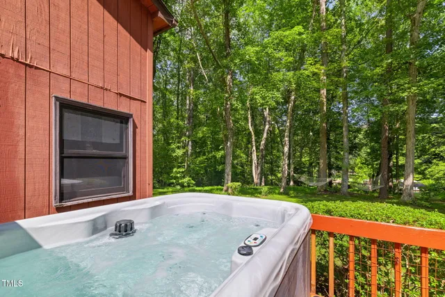 a view of a house with a yard porch and sitting area