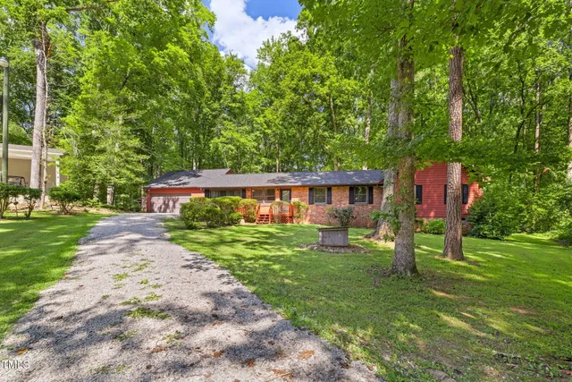 an aerial view of a houses with a lake view