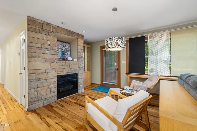 an aerial view of a house with garden space and street view