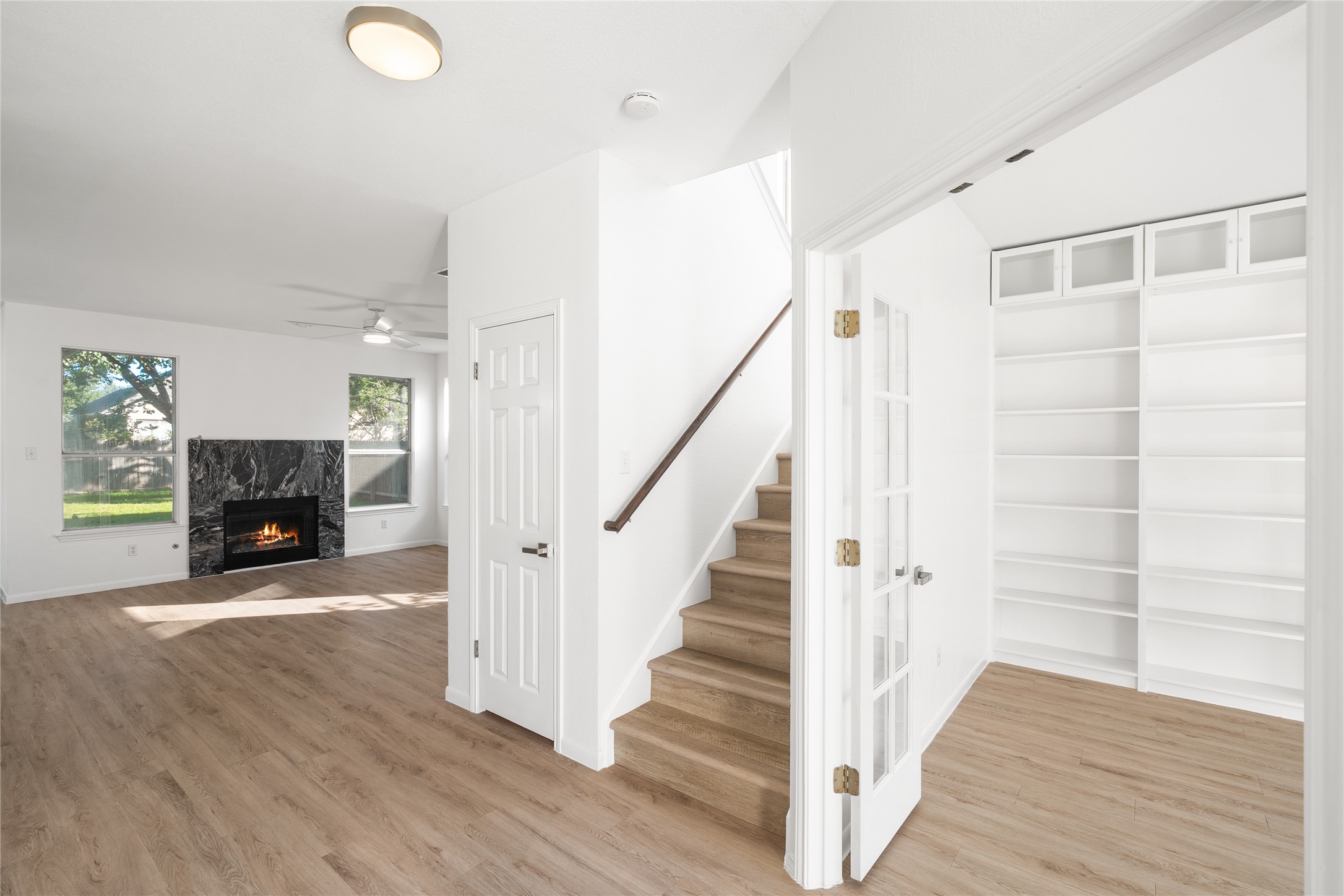206 River Down Road Georgetown, TX 78628 - Photo 5 of 39 Bright interior featuring wood-finish flooring throughout the main level