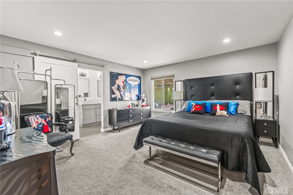 12720 Newport Avenue, Unit 18 Tustin, CA 92780 - Photo 16 of 37 a living room with furniture and a flat screen tv