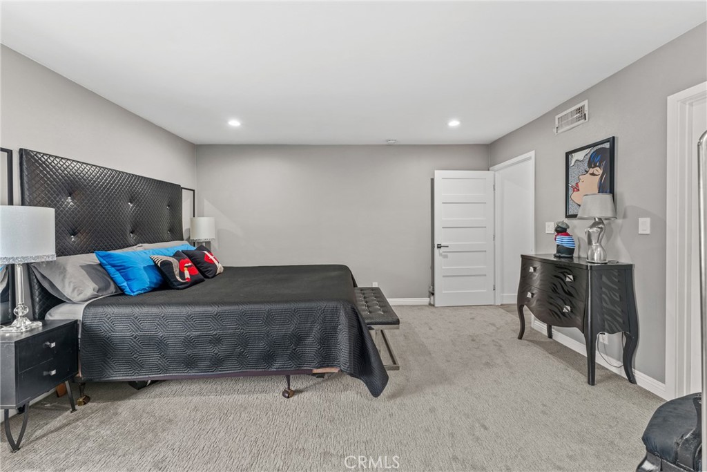 12720 Newport Avenue, Unit 18 Tustin, CA 92780 - Photo 18 of 37 a living room with furniture and a couch