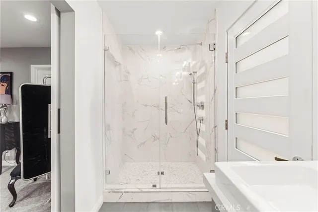 a bathroom with a bathtub and a shower