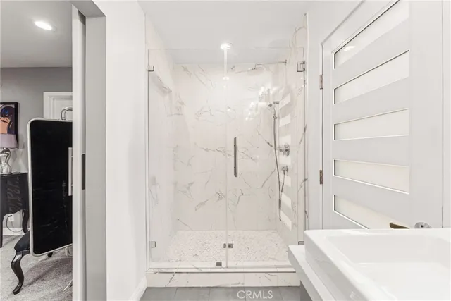 a bedroom with a bed and lamp