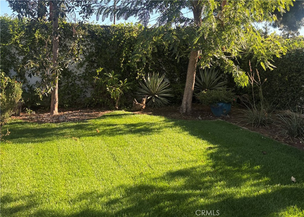 12720 Newport Avenue, Unit 18 Tustin, CA 92780 - Photo 37 of 37 a view of a swimming pool with an outdoor space