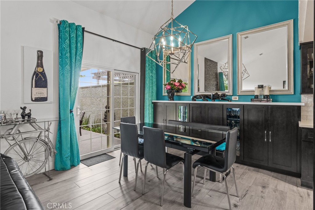 12720 Newport Avenue, Unit 18 Tustin, CA 92780 - Photo 7 of 37 a room with a table and chairs in it