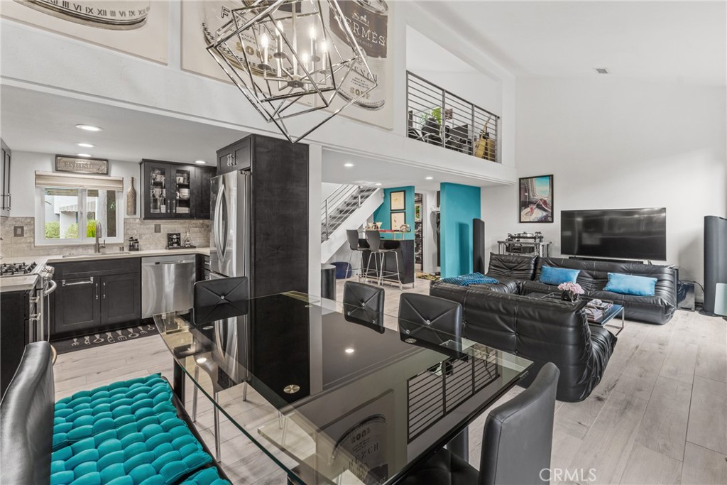 12720 Newport Avenue, Unit 18 Tustin, CA 92780 - Photo 8 of 37 a living room with furniture and a flat screen tv