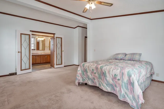 a white bath tub sitting next to a white sink