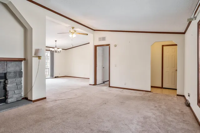 a view of an empty room with a window