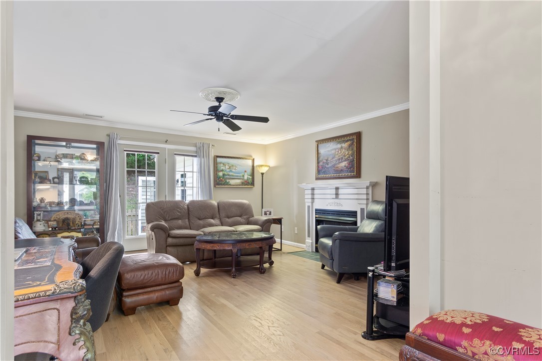 4824 Bristol Circle Williamsburg, VA 23185 - Photo 12 of 36 Living room featuring ceiling fan, ornamental mold
