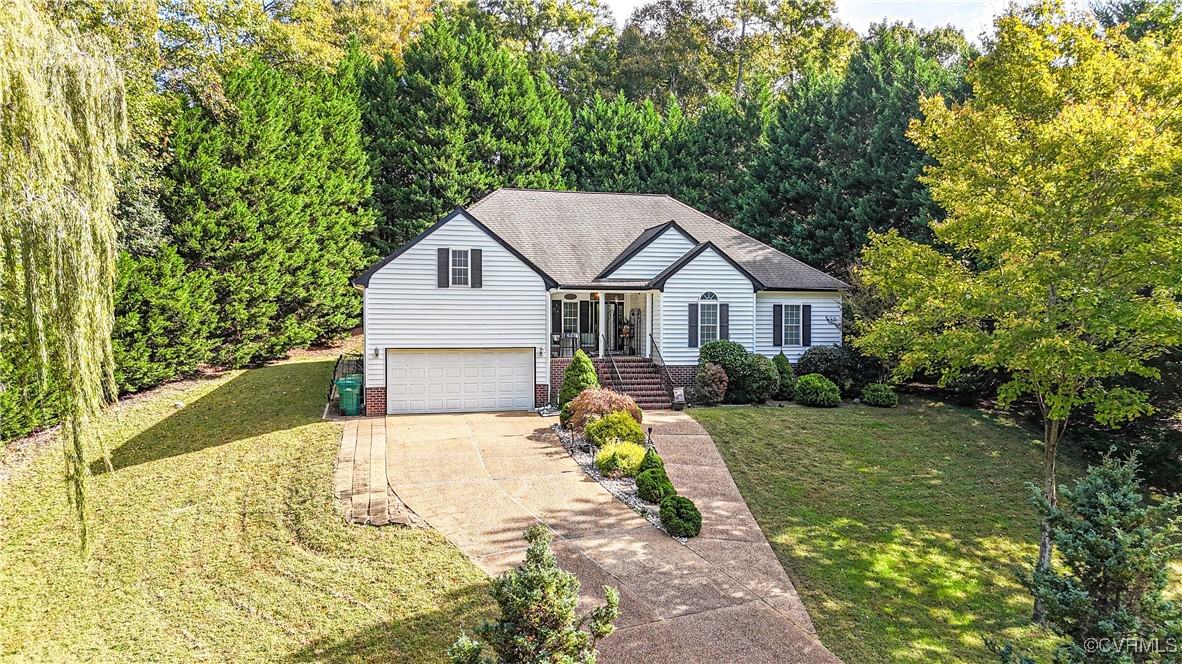 4824 Bristol Circle Williamsburg, VA 23185 - Photo 2 of 36 View of front of house with a front yard and a gar