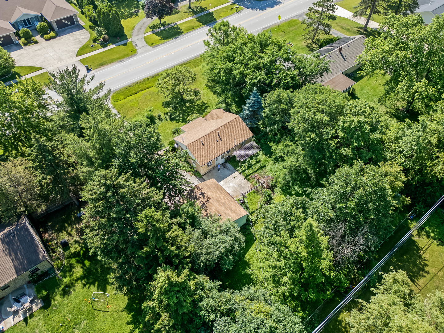 5736 Willow Springs Road La Grange Highlands, IL 60525 - Photo 13 of 14 an aerial view of a house with a yard and trees all around